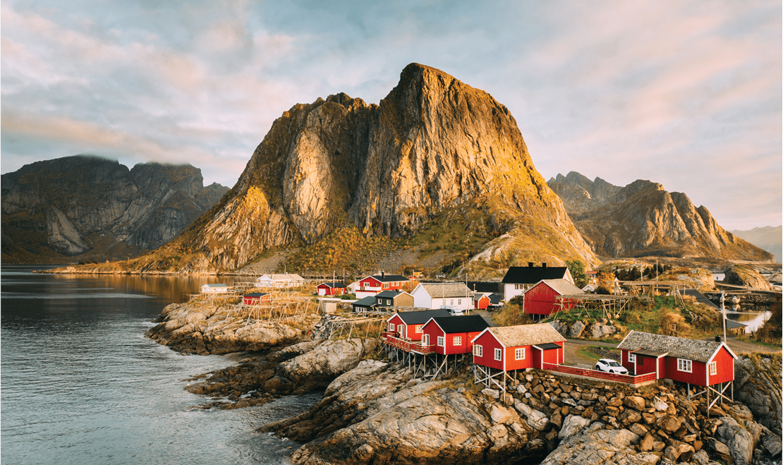 Fishing huts along the coastline of Norway, one of the many stops in 2025 and 2026 for Oceania Cruises.