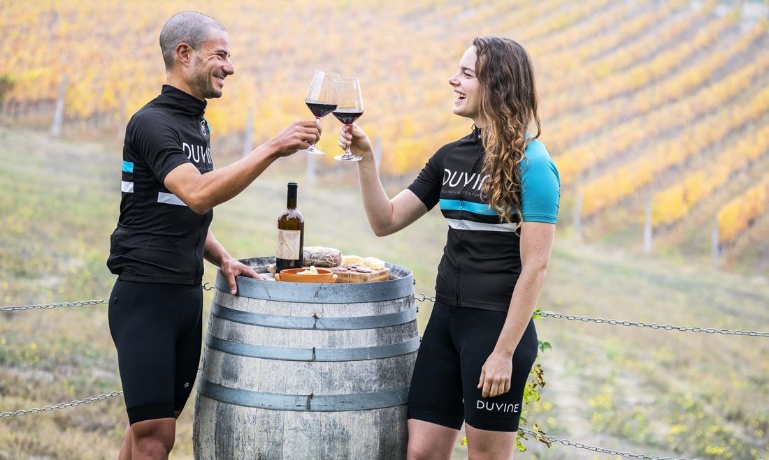Cycling enthusiasts enjoying wine in France