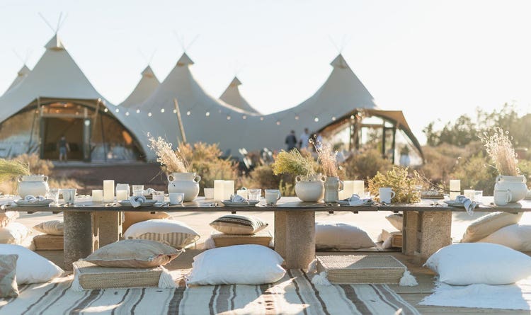 Under Canvas Grand Canyon is set upon 160-acres of woodland. The living area and king guest tent in Moab.